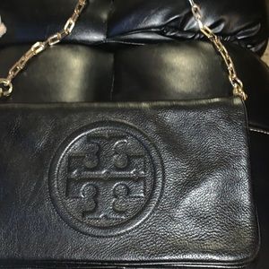 Women’s  Tort Burch black leather reva clutch in excellent condition